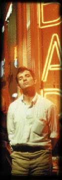 Jack Kerouac in front of neon Bar sign